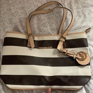 Brown and white Michael Kors tote bag